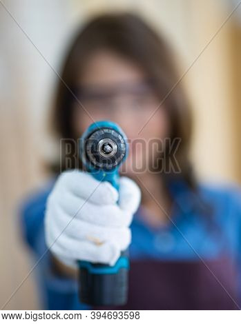 Beautiful Asian Adult Woman Wearing Jeans Clothes Working As A Carpenter In Room At Home. Concept Fo