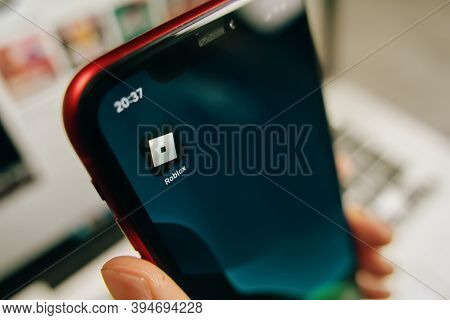 Man Holding A Smartphone With The Roblox Mobile App Icon On Apple Iphone. Bishkek, Kyrgyzstan - Marc