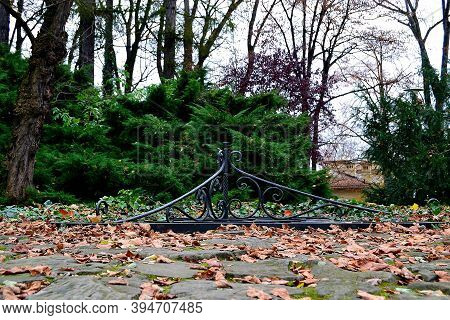 Autumn Photo By Blacksmith Artistically Rendered Well Cover In Castle Park, Cieszyn, Poland