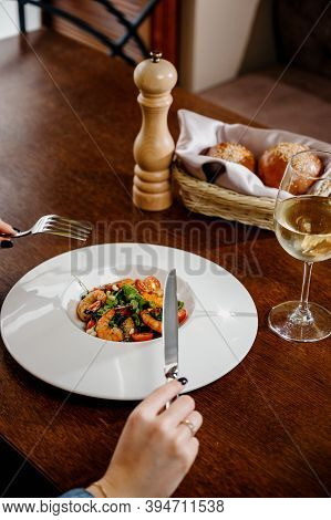 Fresh Salad Plate With Shrimp, Tomato And Mixed Greens On Wooden Background Close Up. Healthy Food.