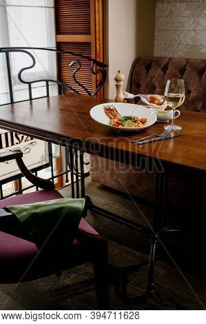 Fresh Salad Plate With Shrimp, Tomato And Mixed Greens On Wooden Background Close Up. Healthy Food.