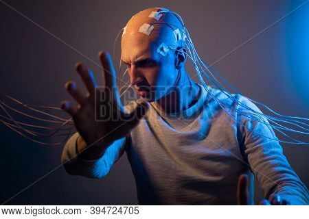 Man With A Bald Head With Wires Connected. Fear And Anxiety. Examination Of The Brain, Mind Control