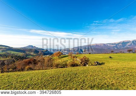 Green Pasture On The Lessinia Plateau In Autumn, On The Right The Monte Baldo (baldo Mountain), Ital