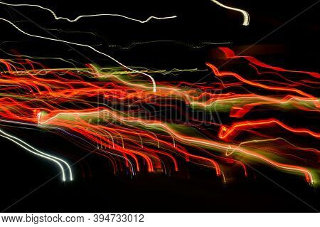 Bright Orange Neon Glowing Fast Moving Streams Of Light, Along A Trajectory. Fast Energy Flying Wave