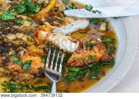 Chicken Francese - Fried Chicken Breast With Lemon Slices And Delicious Sauce On A White Plate Close