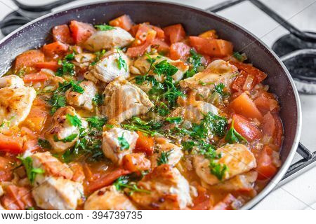 Chicken Cacciatore Is Cooked In A Frying Pan, Chicken Stew With Tomatoes And Red Pepper - Top View
