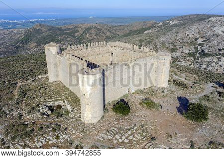 Medieval Castle Called El Montgri At The Top  Mountain Near The Sea In Costa Brava, Catalonia Spain