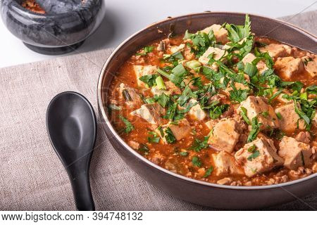 Traditional Chinese Dish Tofu With Minced Meat And Tofu Cheese In A Bowl On A Linen Rustic Napkin, C