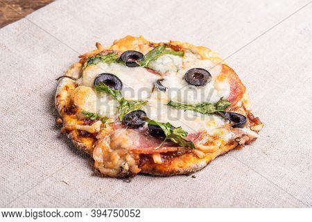 Traditional Italian Appetizer - Mini Pizza, Pizzetta With Sausage, Olives And Mozzarella Cheese On A