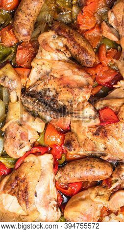 Chicken Scarpariello Close-up - Chicken With Sausages, Peppers, Onions And Tomatoes. American Recipe
