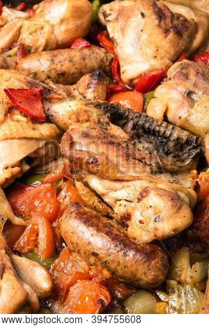 Chicken Scarpariello Close-up - Chicken With Sausages, Peppers, Onions And Tomatoes. American Recipe