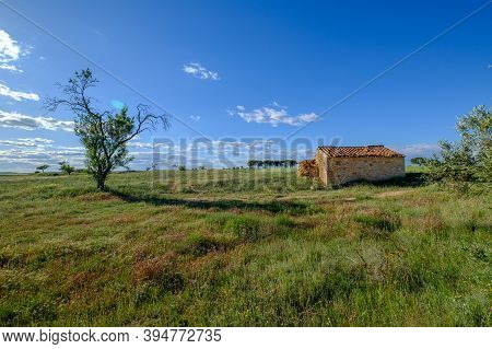 Rustic Rural House Green Field Of Nature Blue Sky, Remote Unpopulated Site