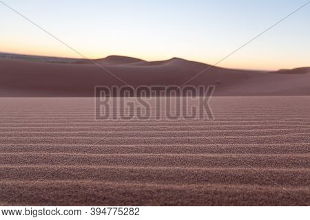 Close-up Desert Dunes Of Erg Chigaga, At Sahara, Al Amanecer. Morocco. Concept Of Travel And Adventu