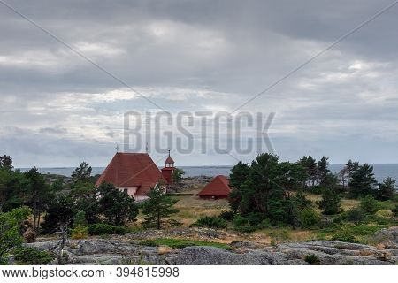 Finland, Aland Islands, Cökar, August - 2019: An Ancient Kircha But An Island Museum Among The Archi