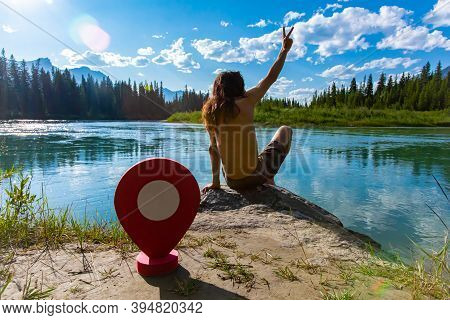 A Destination Waypoint Marker Is Seen Behind A Slim Caucasian Guy Giving The V Peace Sign With His H