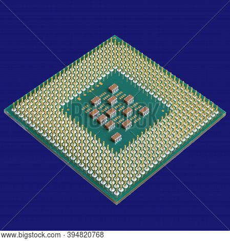 Photo Of A Cpu Chip Isolated On A Blue Background . Microprocessor, Central Processing Unit. Compute
