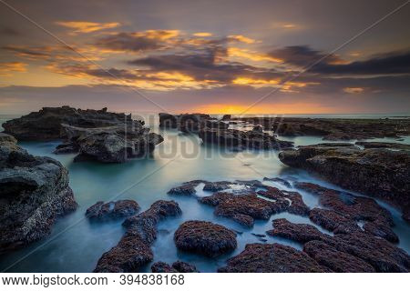 Beautiful Seascape. Long Exposure Rocky Beach During Low Tide. Panoramic Ocean View. Composition Of 