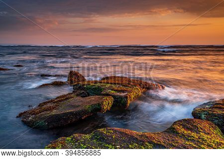 Beautiful Seascape. Beach With Stones Covered By Seaweeds. Low Tide. Composition Of Nature. Motion W