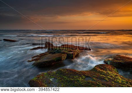 Beautiful Seascape. Beach With Stones Covered By Seaweeds. Low Tide. Composition Of Nature. Motion W
