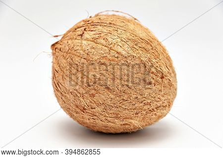 Healthy Food - Whole Coconut In Close-up. Isolated On White Background. Horizontal Shot.