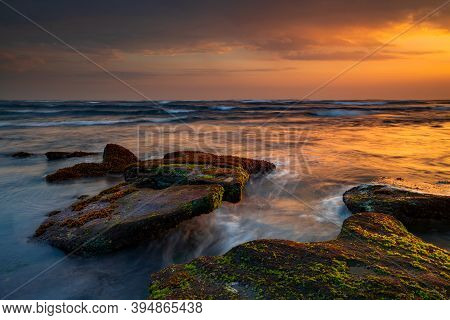 Beautiful Seascape. Beach With Stones Covered By Seaweeds. Low Tide. Composition Of Nature. Motion W