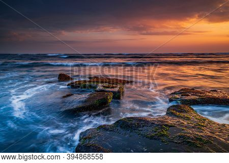 Beautiful Seascape. Beach With Stones Covered By Seaweeds. Low Tide. Composition Of Nature. Motion W