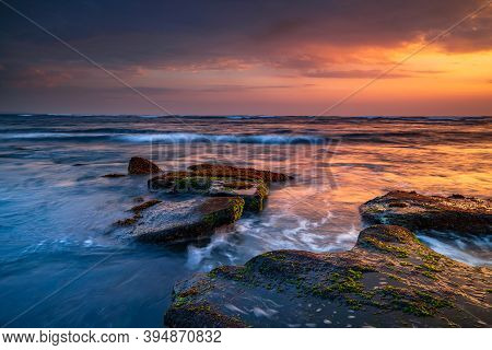 Beautiful Seascape. Beach With Stones Covered By Seaweeds. Low Tide. Composition Of Nature. Motion W