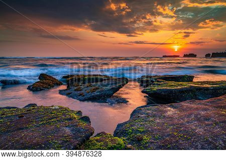 Beautiful Seascape. Beach With Stones Covered By Seaweeds. Low Tide. Composition Of Nature. Motion W