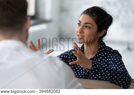 Inspired Young Indian Female Describing Idea To Business Partner