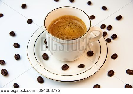 Fragrant Cappuccino On The Background Of Coffee Beans