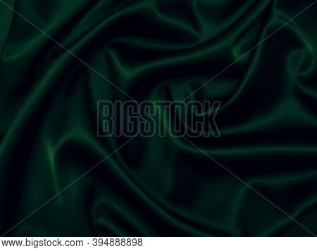 Deep, Rich, Emerald Coloured Satin. Folded And Flowing Background. Decoration Design. Soft Focus. Lu