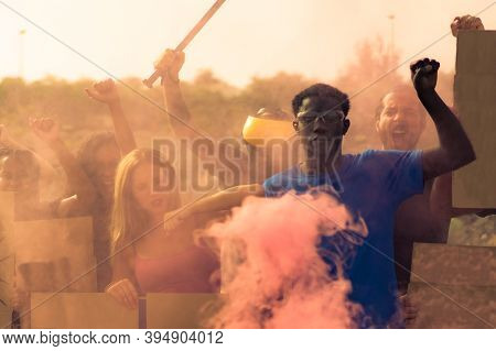Activist Group Going Against Police Throwing Tear Gas. Multiethnic People Fighting For Human Rights,