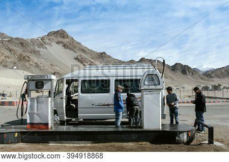Ladakh, Leh, India - December 11, 2020 : Travelers Filling Their Car With Petrol At Indianoil Gas St