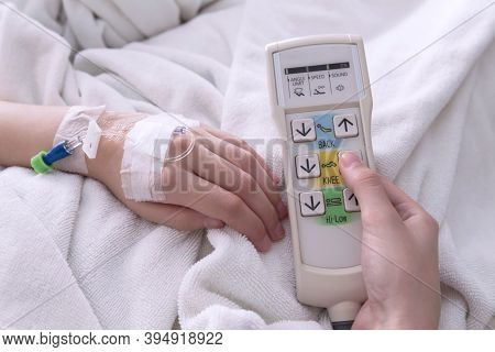 Female Patient Adjust The Height Of The Patient Bed By Press The Button Up Of Automatic Patient Bed 