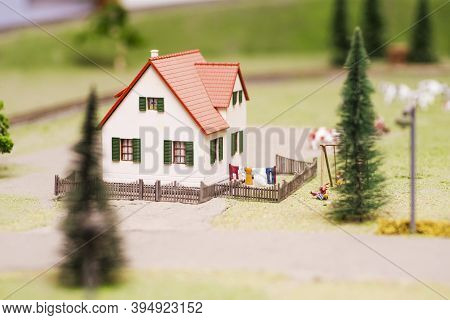 Miniature Toy Farm House. Rural Landscape. Landscape With A House.