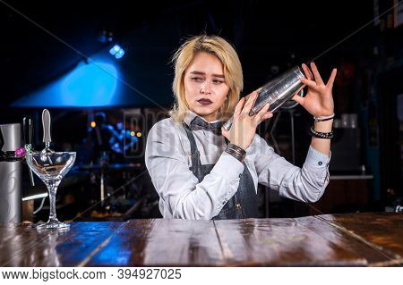 Girl Bartender Concocts A Cocktail On The Brasserie