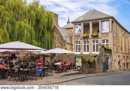 Dinan, France - August 26, 2019: Pavement Cafes With Tourists In Rue Auguste Pavie Near The Theater 