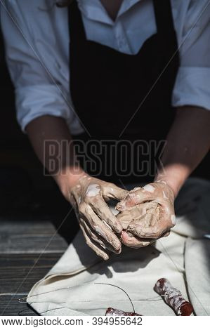 The Potters Woman Hands Are Shaping A Cup From A Clay. The Process Of Creating Pottery. The Master C
