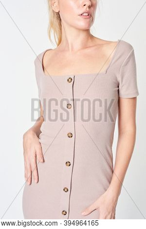 Blonde woman wearing a beige buttoned dress mockup