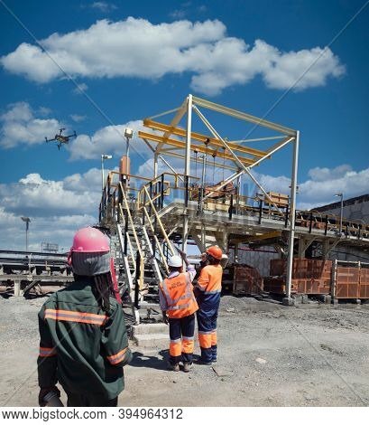 a team of workers in a diamond mine in Botswana operating a drone