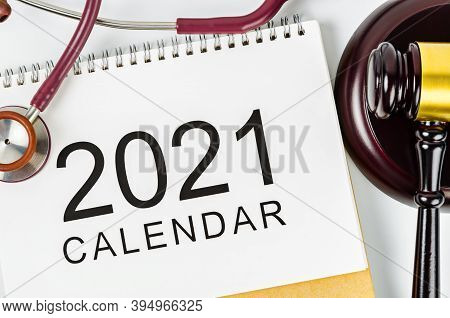 2021 Calendar And Stethoscope Medical With Wooden Judge's Hammer. Health Law Concept.