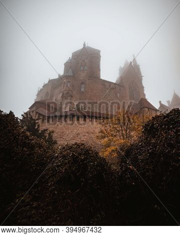 Castle Kreuzenstein In Austria During Autumn On A Foggy Morning