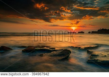 Calm Ocean Long Exposure. Stones In Mysterious Mist Of The Sea Waves. Concept Of Nature Background. 