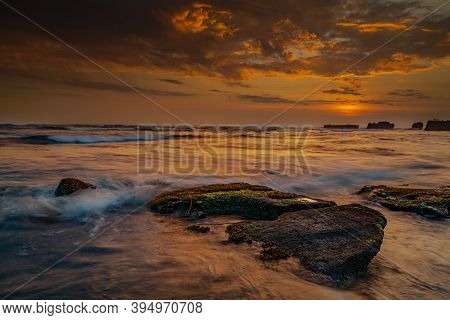 Calm Ocean Long Exposure. Stones In Mysterious Mist Of The Sea Waves. Concept Of Nature Background. 