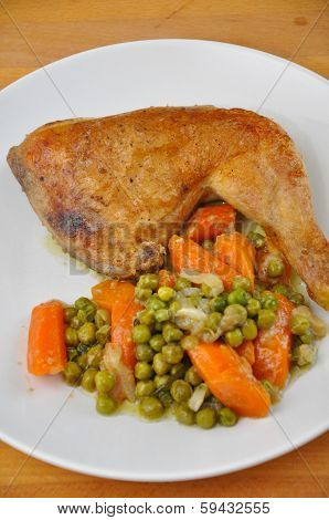 roast chicken leg with peas and carrots