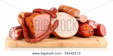 Lot of different sausages on wooden board isolated on white
