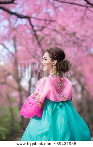 Hanbok: The Traditional Korean Dress And Beautiful Asian Girl With Sakura