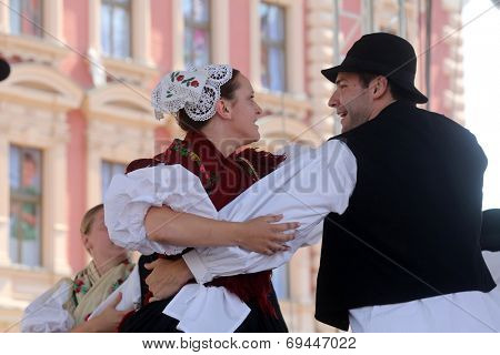 ZAGREB, CROATIA - JULY 19: Members of folk group Seljacka sloga from Donja Dubrava, Croatia during the 48th International Folklore Festival in center of Zagreb, Croatia on July 19, 2014