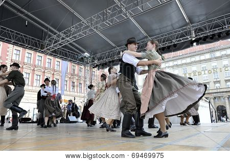 ZAGREB, CROATIA - JULY 19: Members of folk groups Nograd  from Salgotarjan, Hungary during the 48th International Folklore Festival in center of Zagreb, Croatia on July 19, 2014
