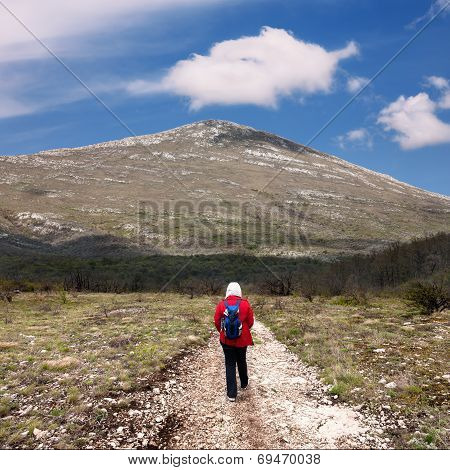 Hiker On The Road To The Mountain Rtanj In Serbia